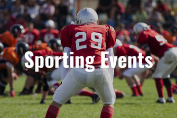 football players in red jerseys prepare for a play to start